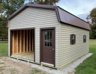 16x22 highwall garage in granville ohio with white garge door and brown entry door including a brown metal roof